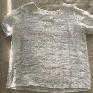 White satiny top with square print